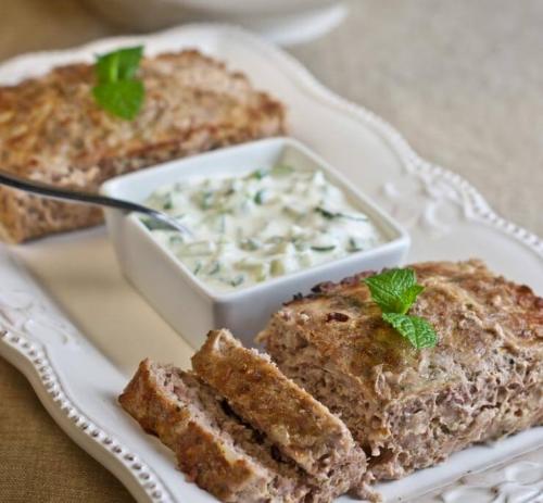 A photo of Gyro Meatloaf with Tzatziki Sauce