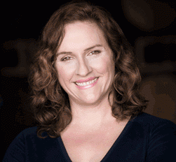 A portrait of winemaker Megan McGrath Gates smiling