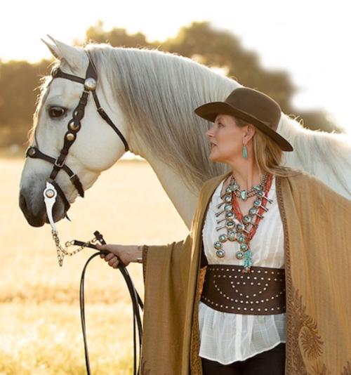 Charlotte in native jewelry with her horse - website https://charlottessy.com/