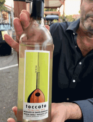 Photo of Mike Lewellen with a wine bottle, an Insta tag by our friends at EdibleSkinny.com